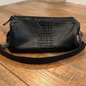 Vintage Brighton Barrel Bag—black leather with patent leather details. 11x5x5”